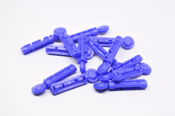 Needling for finger blood test on white background