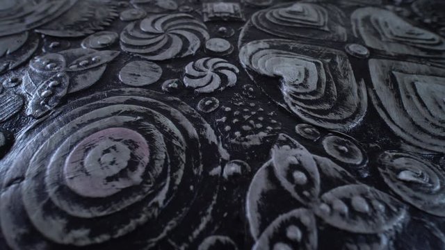 Abstract black grunge floral background. Plastic, acrylic paint flowers on canvas art. Luxury rotating motion texture. 4k.