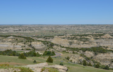 Fototapeta na wymiar Late Spring in the North Dakota Badlands: Looking Northeast Across the Access Road into the South Unit of Theodore Roosevelt National Park From the Top of Buck Hill