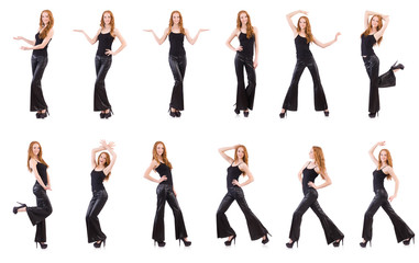 Fototapeta premium Redhead woman in black bell bottom pants on white