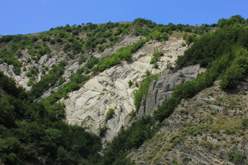 Light and dark cliffs in the mountains.