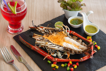 Grilled Lobster and souce on plate.