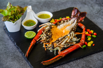 Grilled Lobster and seafood souce on plate.