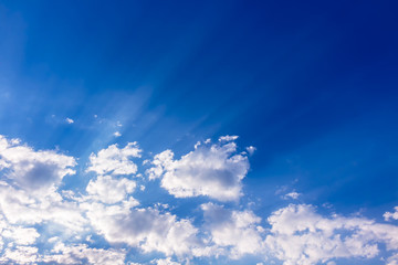 Blue sky with sun beam light and clouds