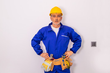 construction worker or professional man with tools and helmet