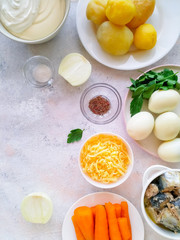 Ingredients for salad with Mimosa fish on a light background top view. Cooking food step by step.