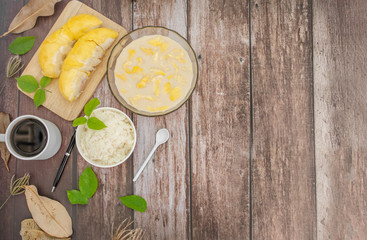 Sticky rice with durian(top view) on a wooden background.