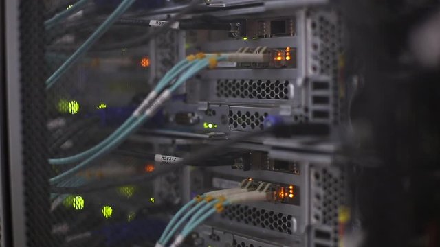 Optical fiber with connector of FC type pig tail in server room. Video contains vibration.