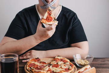 Diet restricts, weight loss, eating disorder. Anorexia and bulimia concept. Obese woman with pizza,...
