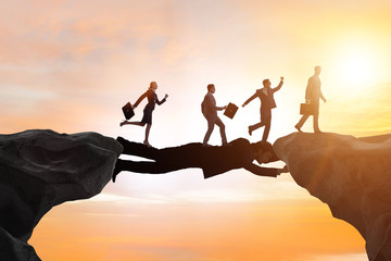 Businessman acting as a bridge in support concept