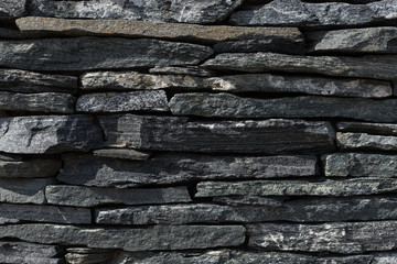 Wall background of volcanic andesite basalt stone texture - architecture background. natural stone...