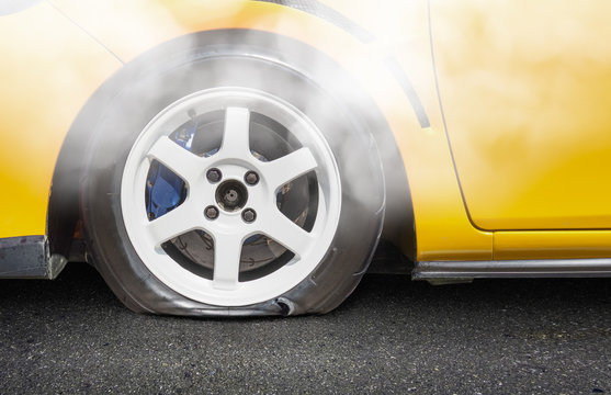 burst car tire on road