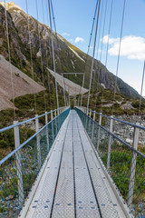 Fototapeta na wymiar Hiker bridge at Hooker valley in New Zealand.