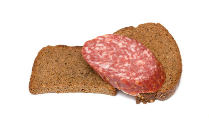 A slice of smoked salami sausage and bread isolated on a white background.