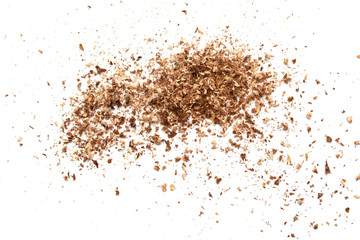 Small wooden shavings of sawdust on a white background.