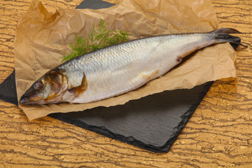 Salted herring over the wooden board