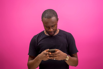 young black happy man using his smartphone to chat