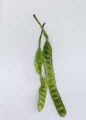 Petai, Bitter Beans on wood table, Thai vegetable food, Parkia speciosa seeds