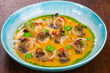 Scallops with sauce and chili