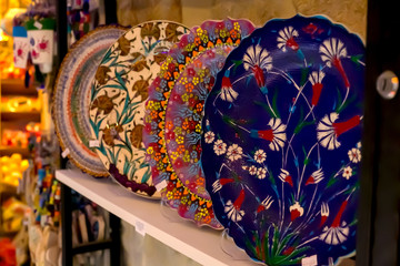 Gift shop with a variety of Turkish kiramika for sale. The background is blurred.