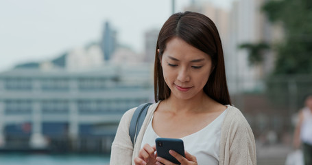 Woman use of mobile phone at outdoor