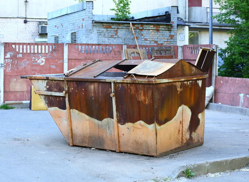 Old Rusty Dumpster In The Yard At The Waste Collection Site