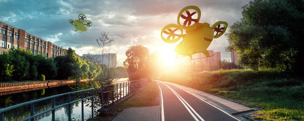 Yellow flying taxi against the sky, city electric transport drone. Car with propellers, clean air,...