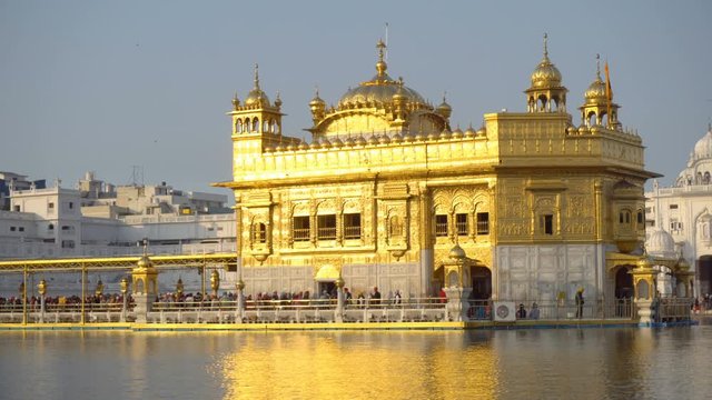 Travel and Sightseeing in India - Famous Golden Temple of Sikhism Religion and Holy Pool of Water in Amritsar