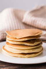 Homemade delicious pancakes on white plate. Breakfast concept