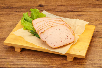 Boiled pork sausage over board