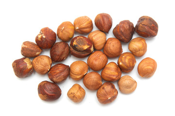 Hazelnut kernels are isolated on a white background.