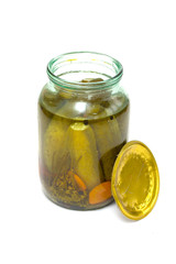 Glass jar, pickles with cucumbers, white background.