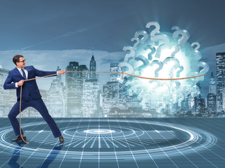 Obraz premium Businessman pulling question marks in uncertainty concept