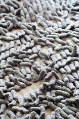 Closeup dirty grey doormat pattern.