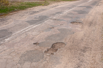 pits on the asphalt. bad asphalt.