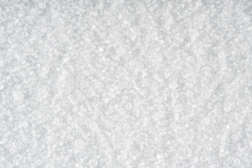 Fototapeta na wymiar Light background of sprinkled salt at high magnification