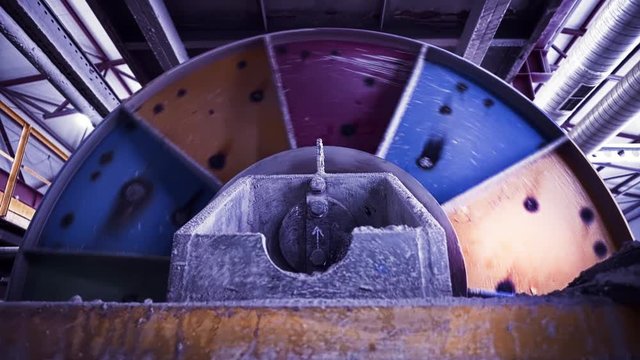 Rotating tanks in factory. Stock footage. Rotating turbines and tanks for processing raw materials at plant. Large steel tank rotates stirring raw material
