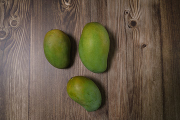 Selective focus of Malaysian or Asian favourite mango fruit called Mangga Harum Manis or Harumanis on the top of wooden table.