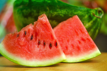 sliced ​​slices of sweet watermelon, background with slices of watermelon