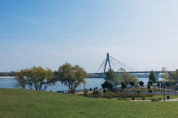 view of the bridge over the river from the city park
