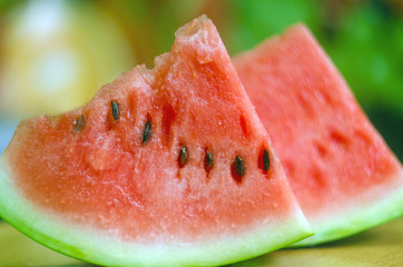 sliced ​​slices of sweet watermelon, background with slices of watermelon