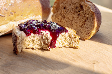 bitten sandwich with jam, healthy food, ugly delicious concept, copy space