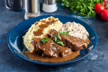 Stewed pork neck with potatoes and sauce