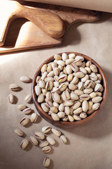 Salted pistachio in wooden bowl 