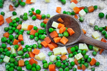 fresh carrot peas on the kitchen table