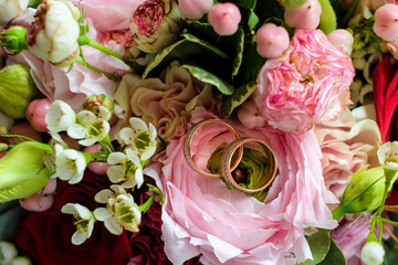 wedding rings on flowers