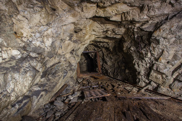Underground old abandoned iron mine tunnel