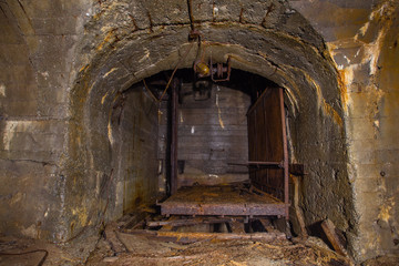 Fototapeta na wymiar Underground old abandoned iron mine tunnel with lift
