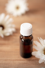 aroma oil in a bottle on a wooden table