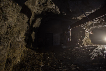 Fototapeta na wymiar Underground old abandoned iron mine tunnel ventilation system